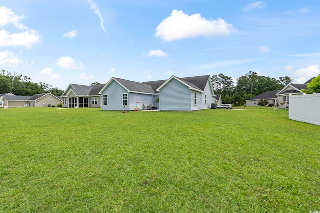 282 Foxpath Loop, Myrtle Beach, SC 29588 - back of house featuring a yard and central AC
