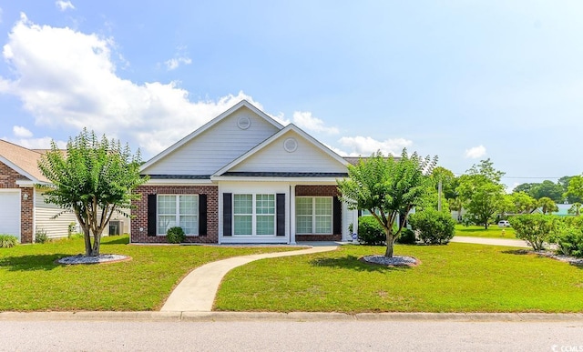 2499 Burning Tree Ln, Little River, SC 29566 - view of front facade with a front lawn and brick siding