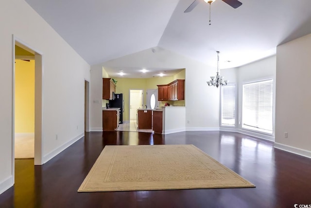 2499 Burning Tree Ln, Little River, SC 29566 - kitchen with vaulted ceiling, a chandelier, a ceiling fan, freestanding refrigerator, and dark wood finished floors