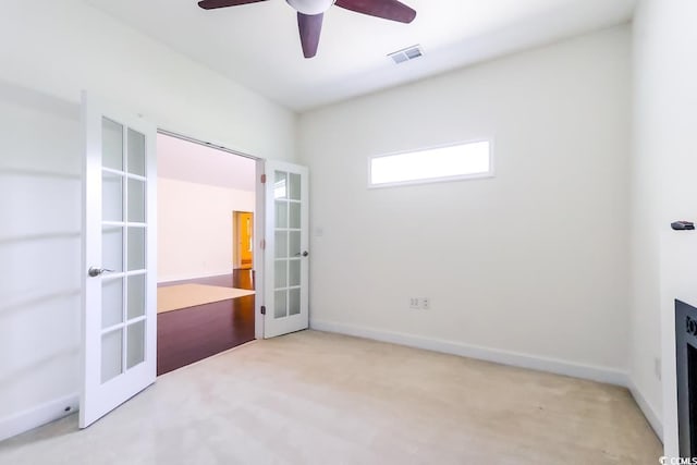 2499 Burning Tree Ln, Little River, SC 29566 - unfurnished bedroom with french doors, carpet floors, baseboards, and ceiling fan