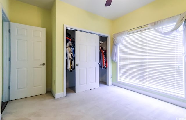 2499 Burning Tree Ln, Little River, SC 29566 - unfurnished bedroom with light carpet, a closet, ceiling fan, and baseboards