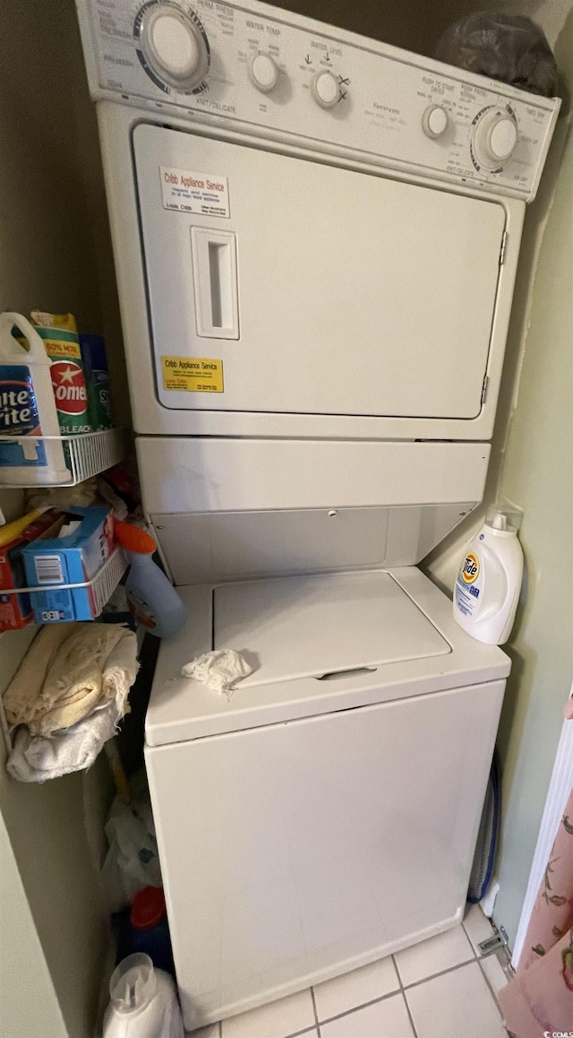 4753 Wild Iris Dr Unit 301, Myrtle Beach, SC 29577 - washroom featuring stacked washer / dryer and tile patterned floors