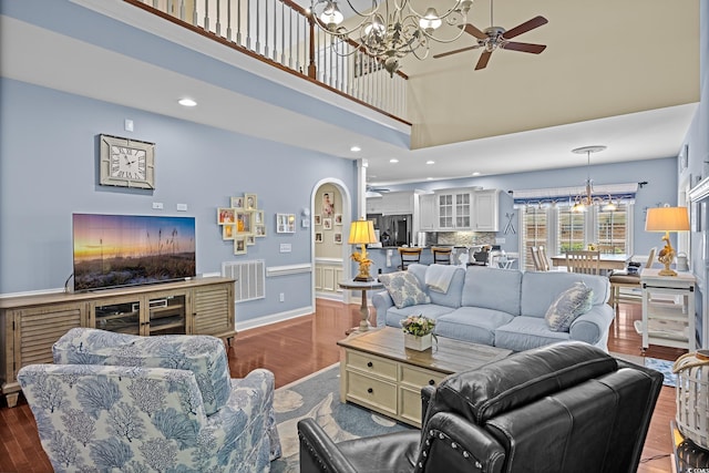 504 Sea Vista Ln, North Myrtle Beach, SC 29582 - living area featuring a chandelier, ceiling fan, a high ceiling, dark wood-style floors, and recessed lighting
