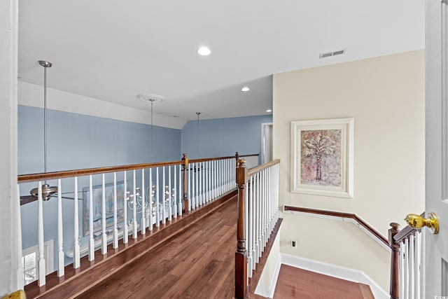 504 Sea Vista Ln, North Myrtle Beach, SC 29582 - hallway with an upstairs landing, wood finished floors, recessed lighting, and baseboards