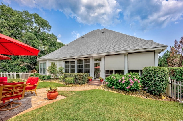 504 Sea Vista Ln, North Myrtle Beach, SC 29582 - back of property with roof with shingles and a patio