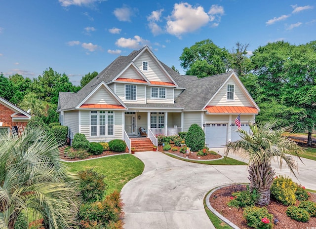 504 Sea Vista Ln, North Myrtle Beach, SC 29582 - view of front of property with a standing seam roof, covered porch, roof with shingles, and metal roof