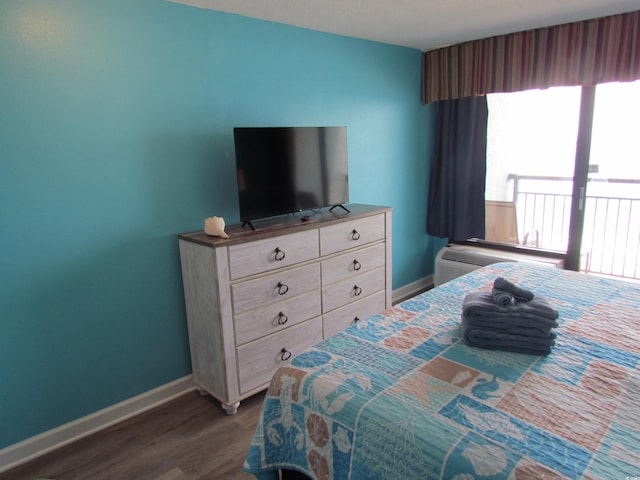6804 N Ocean Blvd Unit 1023, Myrtle Beach, SC 29572 - bedroom featuring multiple windows and dark wood-style flooring