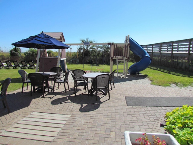 6804 N Ocean Blvd Unit 1023, Myrtle Beach, SC 29572 - fenced backyard with outdoor dining area and a patio area