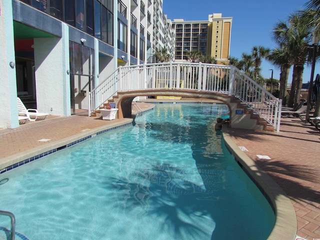 6804 N Ocean Blvd Unit 1023, Myrtle Beach, SC 29572 - community pool featuring stairway