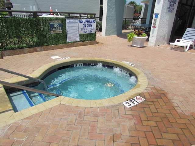 6804 N Ocean Blvd Unit 1023, Myrtle Beach, SC 29572 - view of pool with a hot tub