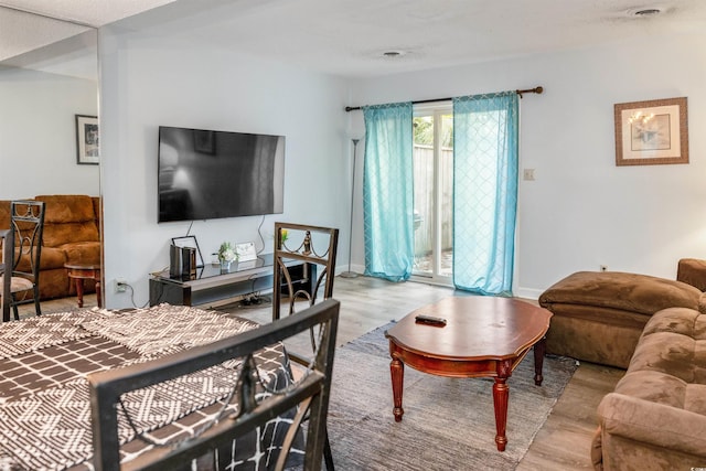 4505 N Kings Hwy # E2, Myrtle Beach, SC 29577 - bedroom with wood finished floors, access to outside, and baseboards