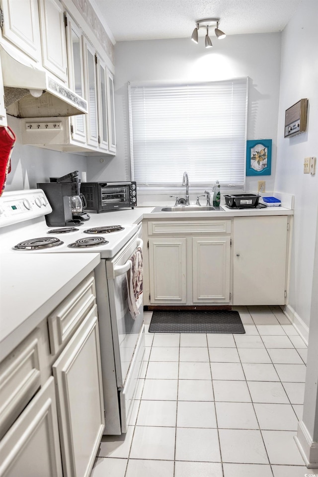 4505 N Kings Hwy # E2, Myrtle Beach, SC 29577 - kitchen featuring white electric range, a sink, under cabinet range hood, light countertops, and light tile patterned floors