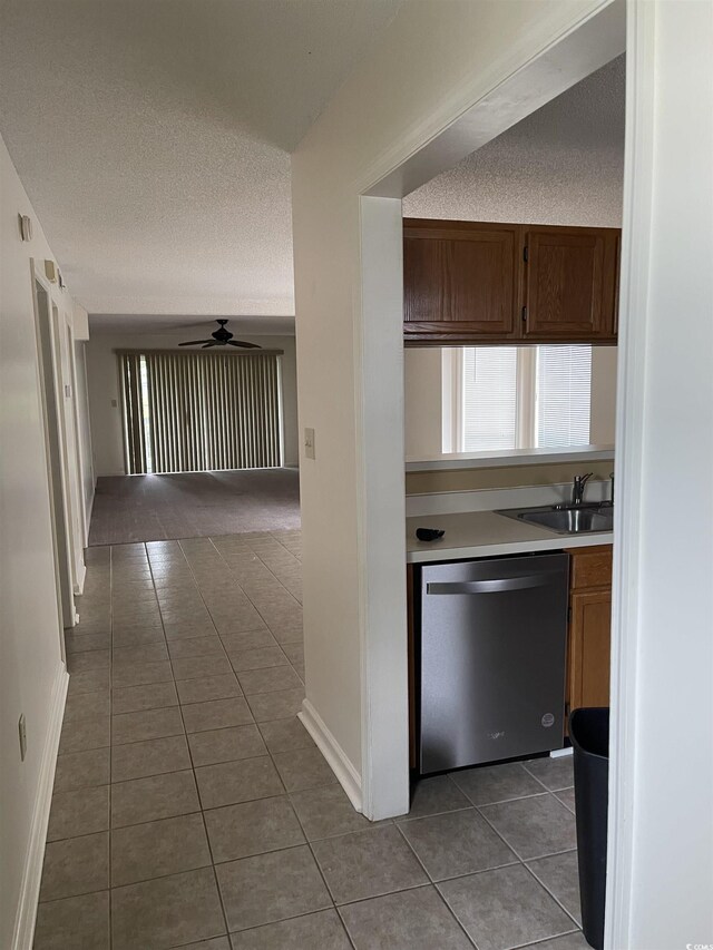 770 Charter Dr Unit C4, Longs, SC 29568 - kitchen featuring dishwasher, dark tile patterned flooring, light countertops, a textured ceiling, and a ceiling fan