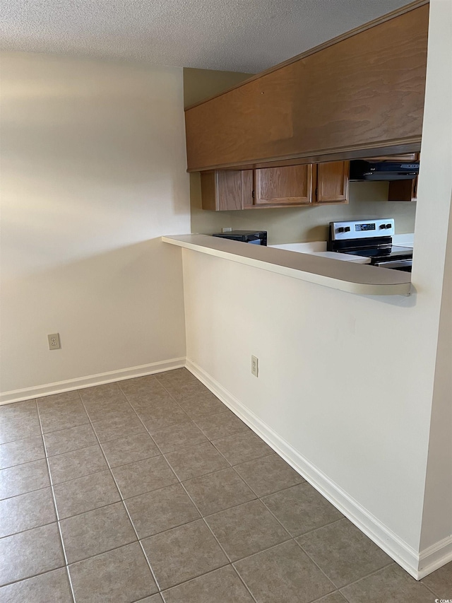 770 Charter Dr Unit C4, Longs, SC 29568 - kitchen featuring electric stove, extractor fan, tile patterned floors, a textured ceiling, and light countertops