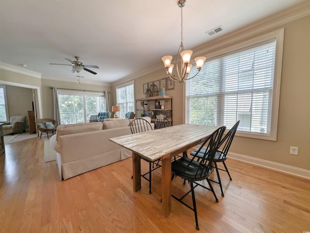 82 Mingo Dr Unit 2D, Pawleys Island, SC 29585 - dining room with a chandelier, ornamental molding, light wood-style flooring, baseboards, and a ceiling fan