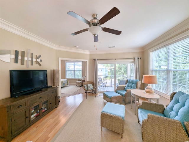82 Mingo Dr Unit 2D, Pawleys Island, SC 29585 - living area with light wood-style floors, ceiling fan, and ornamental molding