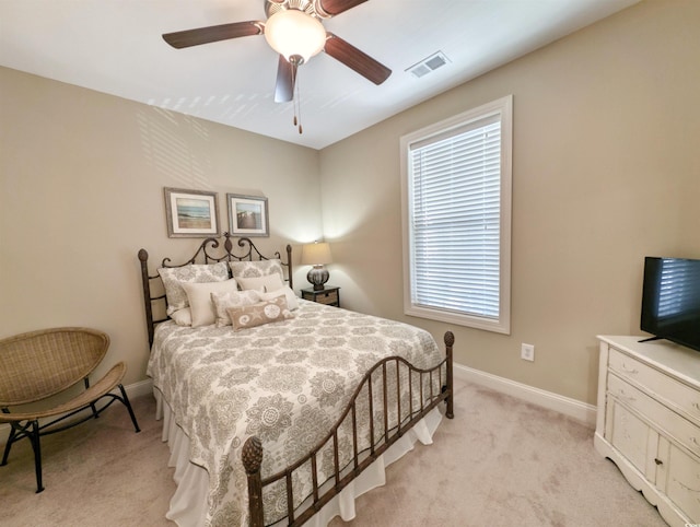82 Mingo Dr Unit 2D, Pawleys Island, SC 29585 - bedroom featuring light carpet, baseboards, and a ceiling fan