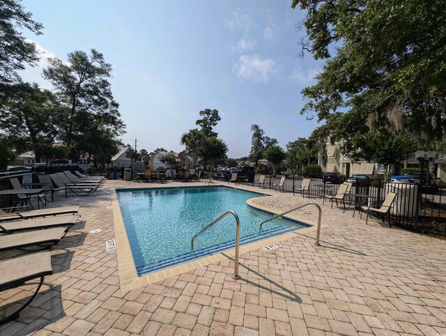 82 Mingo Dr Unit 2D, Pawleys Island, SC 29585 - community pool with a patio area