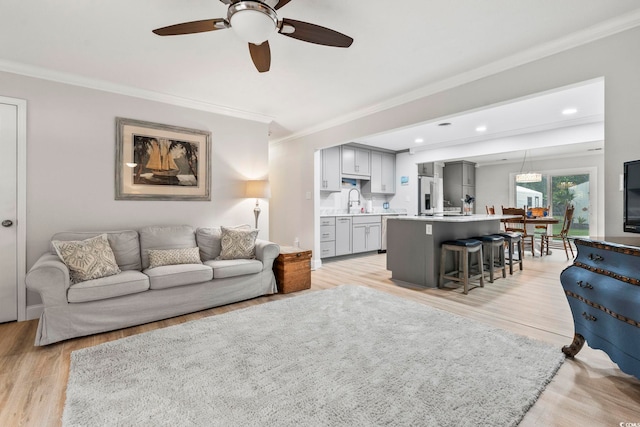 1223 Naylor Ave, Myrtle Beach, SC 29577 - living room with crown molding, light wood-type flooring, ceiling fan, and recessed lighting