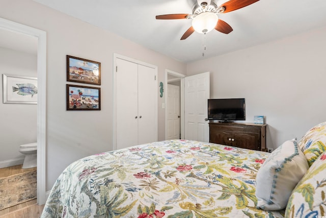 1223 Naylor Ave, Myrtle Beach, SC 29577 - bedroom featuring wood finished floors, baseboards, connected bathroom, a closet, and ceiling fan