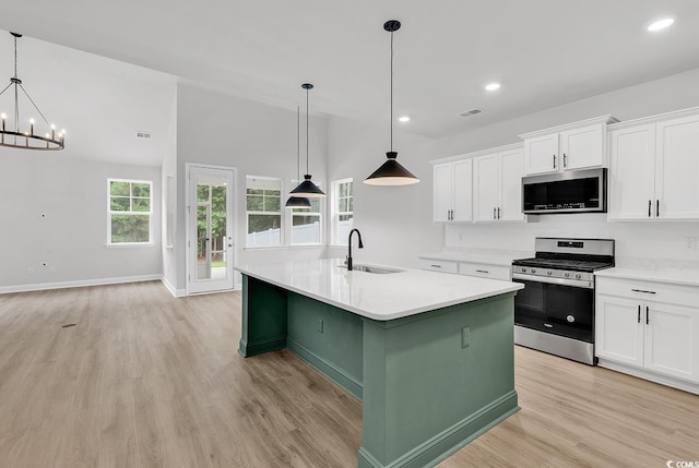 218 Calhoun Falls Dr, Myrtle Beach, SC 29579 - kitchen featuring appliances with stainless steel finishes, a sink, light wood-style flooring, white cabinets, and recessed lighting
