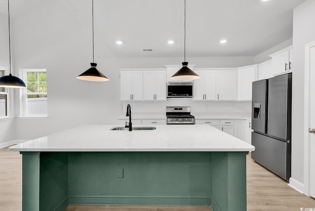 218 Calhoun Falls Dr, Myrtle Beach, SC 29579 - kitchen with appliances with stainless steel finishes, a sink, white cabinetry, light wood-style floors, and recessed lighting