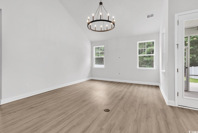 218 Calhoun Falls Dr, Myrtle Beach, SC 29579 - unfurnished dining area with a chandelier, healthy amount of natural light, wood finished floors, baseboards, and high vaulted ceiling