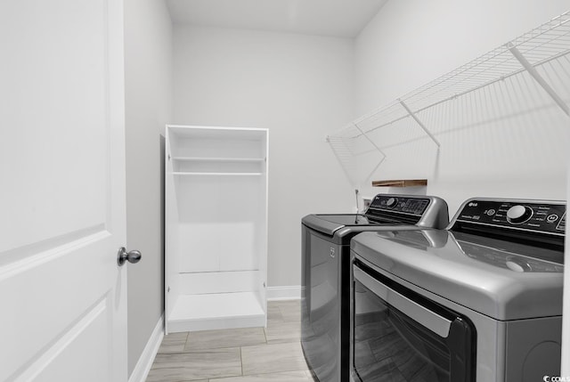 218 Calhoun Falls Dr, Myrtle Beach, SC 29579 - laundry area featuring washer and clothes dryer, baseboards, and light marble finish flooring