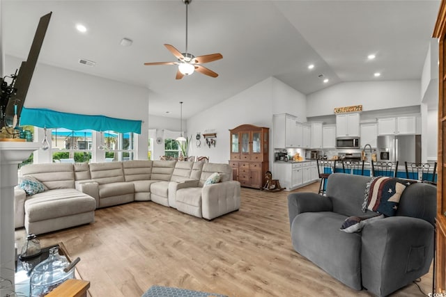 1833 Lake Egret Dr, North Myrtle Beach, SC 29582 - living area with a ceiling fan, high vaulted ceiling, light wood finished floors, and recessed lighting