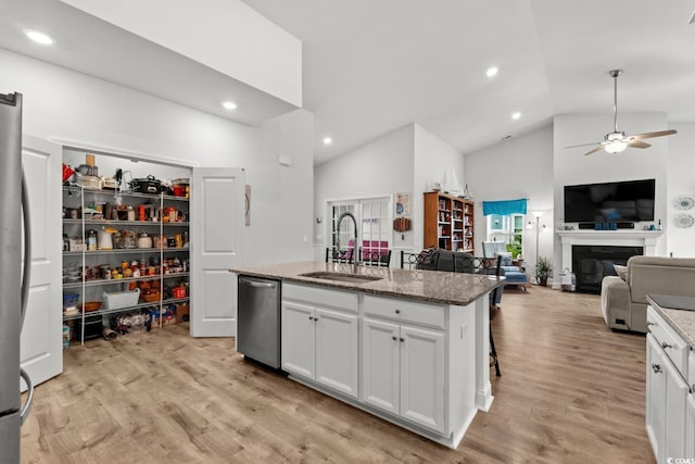 1833 Lake Egret Dr, North Myrtle Beach, SC 29582 - kitchen featuring a sink, stainless steel appliances, high vaulted ceiling, a ceiling fan, and light stone counters