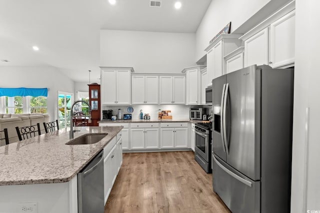 1833 Lake Egret Dr, North Myrtle Beach, SC 29582 - kitchen with appliances with stainless steel finishes, a sink, white cabinetry, light wood-style floors, and recessed lighting
