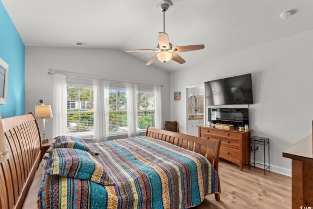 1833 Lake Egret Dr, North Myrtle Beach, SC 29582 - bedroom featuring lofted ceiling, light wood-style flooring, baseboards, and ceiling fan