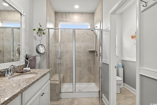 1833 Lake Egret Dr, North Myrtle Beach, SC 29582 - bathroom featuring toilet, vanity, a stall shower, and tile patterned floors