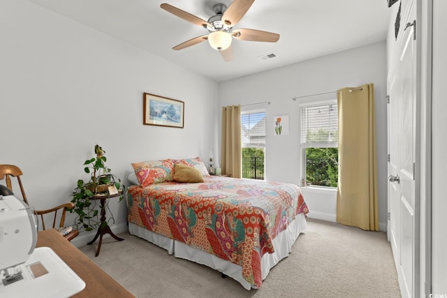 1833 Lake Egret Dr, North Myrtle Beach, SC 29582 - bedroom with light carpet, a ceiling fan, and baseboards