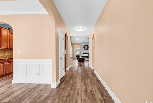 1410 Bohicket Ct, Myrtle Beach, SC 29579 - hallway with light wood finished floors, arched walkways, and baseboards