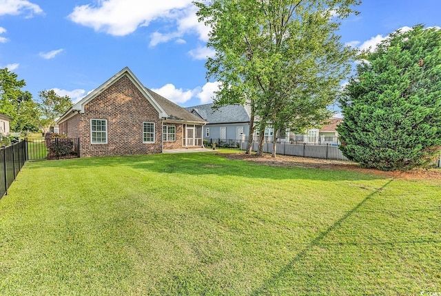 1410 Bohicket Ct, Myrtle Beach, SC 29579 - back of house featuring brick siding and a fenced backyard