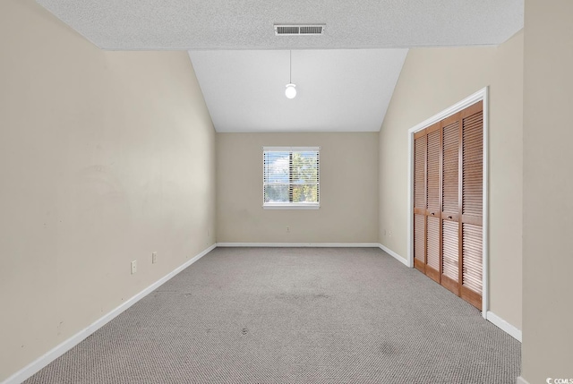 3700 Golf Colony Ln Unit 25G, Little River, SC 29566 - unfurnished bedroom with carpet, lofted ceiling, and a closet