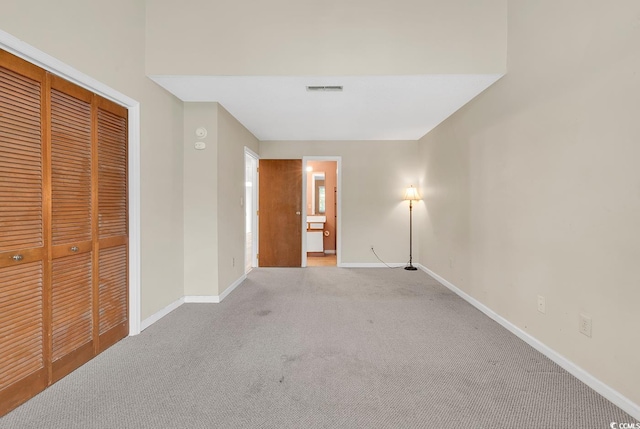 3700 Golf Colony Ln Unit 25G, Little River, SC 29566 - unfurnished bedroom featuring light carpet and a closet