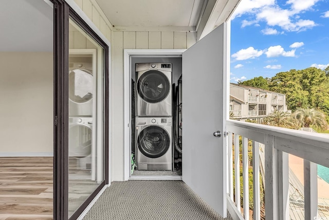 3700 Golf Colony Ln Unit 25G, Little River, SC 29566 - laundry area with stacked washer / drying machine and carpet flooring
