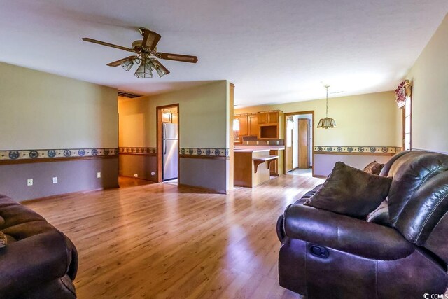 3150 Dusty Rd, Loris, SC 29569 - living room featuring light wood-style floors and a ceiling fan