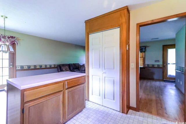 3150 Dusty Rd, Loris, SC 29569 - kitchen featuring healthy amount of natural light, light countertops, open floor plan, and hanging light fixtures