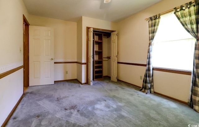 3150 Dusty Rd, Loris, SC 29569 - unfurnished bedroom featuring multiple windows, carpet, and a closet