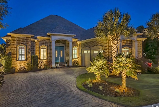 1108 Surf Pointe Dr, North Myrtle Beach, SC 29582 - view of front of property with a garage, brick siding, and driveway
