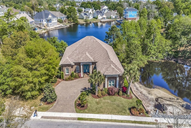 1108 Surf Pointe Dr, North Myrtle Beach, SC 29582 - aerial perspective of suburban area with a large body of water and a tree filled landscape