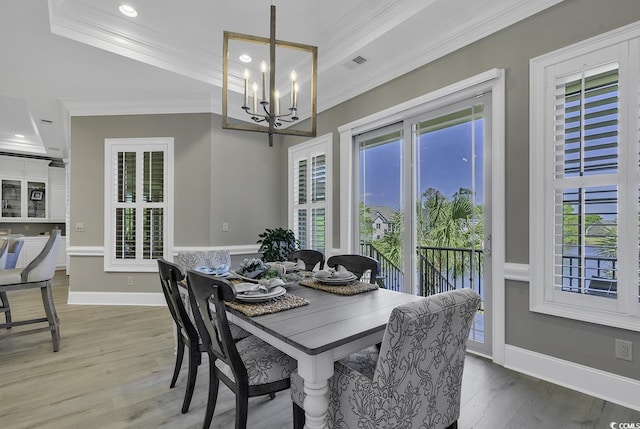 1108 Surf Pointe Dr, North Myrtle Beach, SC 29582 - dining area with crown molding, a chandelier, wood finished floors, recessed lighting, and baseboards