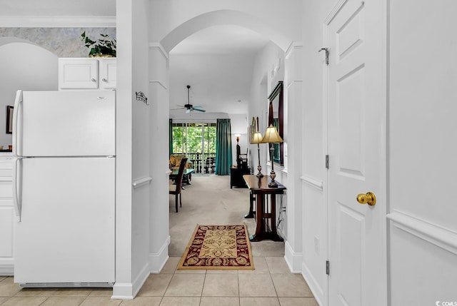6015 Catalina Dr Unit 733, North Myrtle Beach, SC 29582 - corridor featuring arched walkways, light tile patterned floors, light carpet, and baseboards