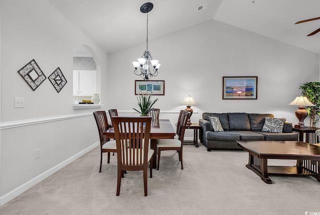 6015 Catalina Dr Unit 733, North Myrtle Beach, SC 29582 - dining area with vaulted ceiling, light carpet, a ceiling fan, a chandelier, and arched walkways