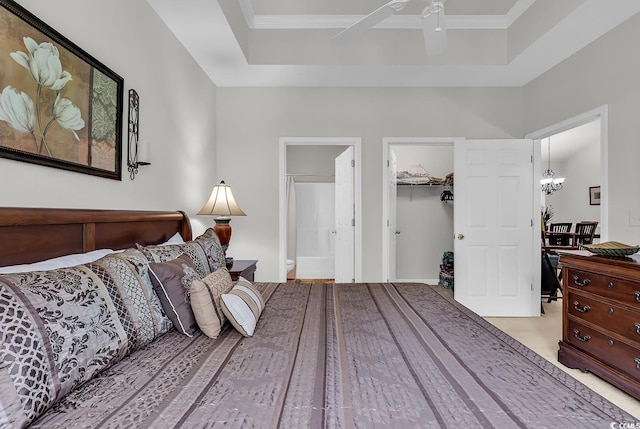 6015 Catalina Dr Unit 733, North Myrtle Beach, SC 29582 - bedroom with connected bathroom, a raised ceiling, a walk in closet, and a chandelier