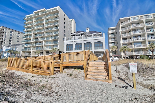 6015 Catalina Dr Unit 733, North Myrtle Beach, SC 29582 - rear view of house featuring a chimney