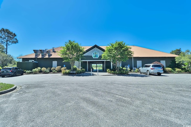 6015 Catalina Dr Unit 733, North Myrtle Beach, SC 29582 - view of building exterior with uncovered parking